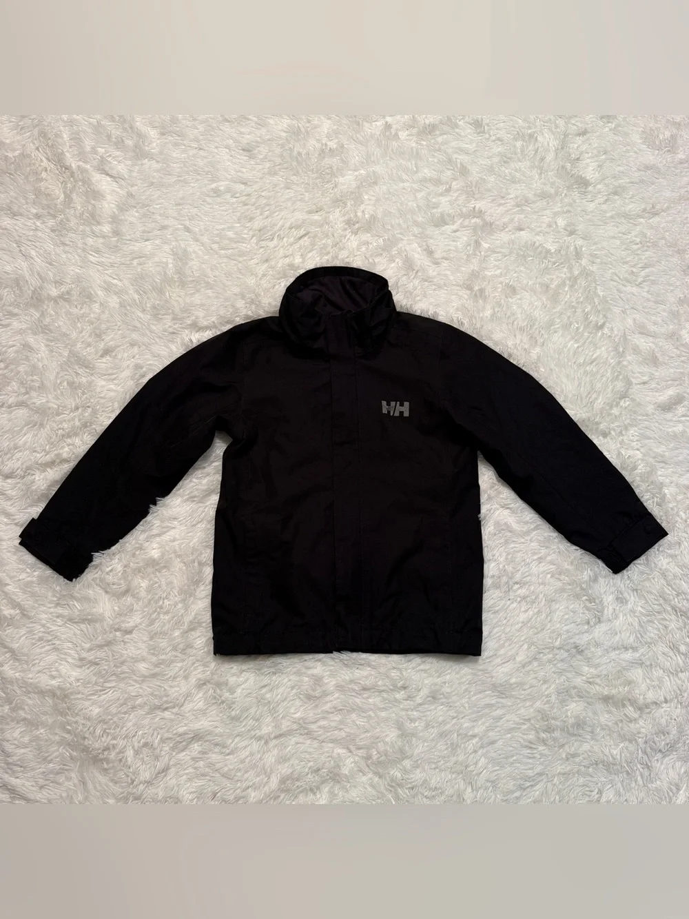 Child’s Size 8 / 128 Black Helly Hansen Waterproof Rain Jacket. Good Condition.